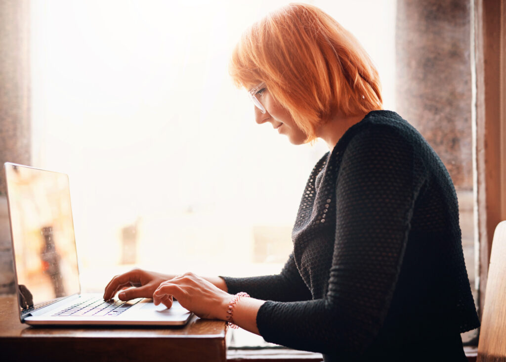 business woman, laptop and remote work at cafe for online meetin